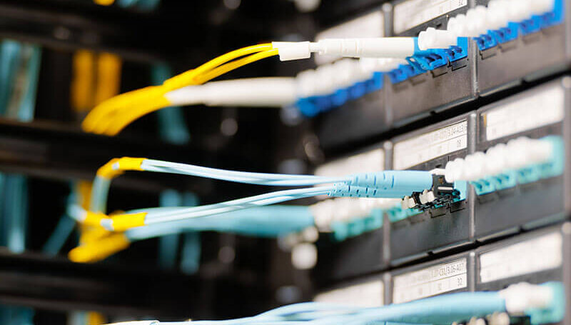 A photo showing data cables and a server